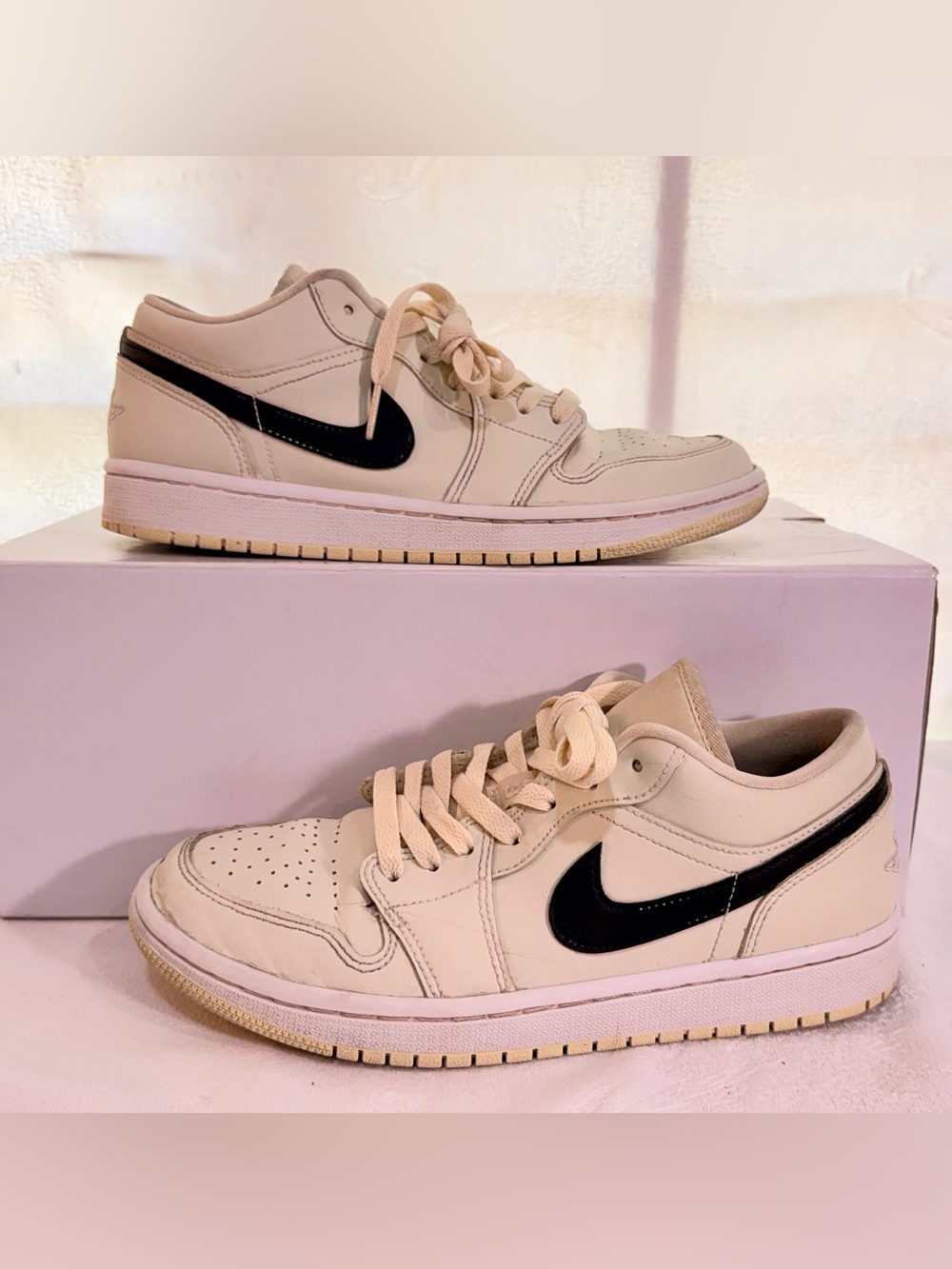 Nike AJ 1 Low Top Sneakers in Coconut Milk with Black Swoosh S0039